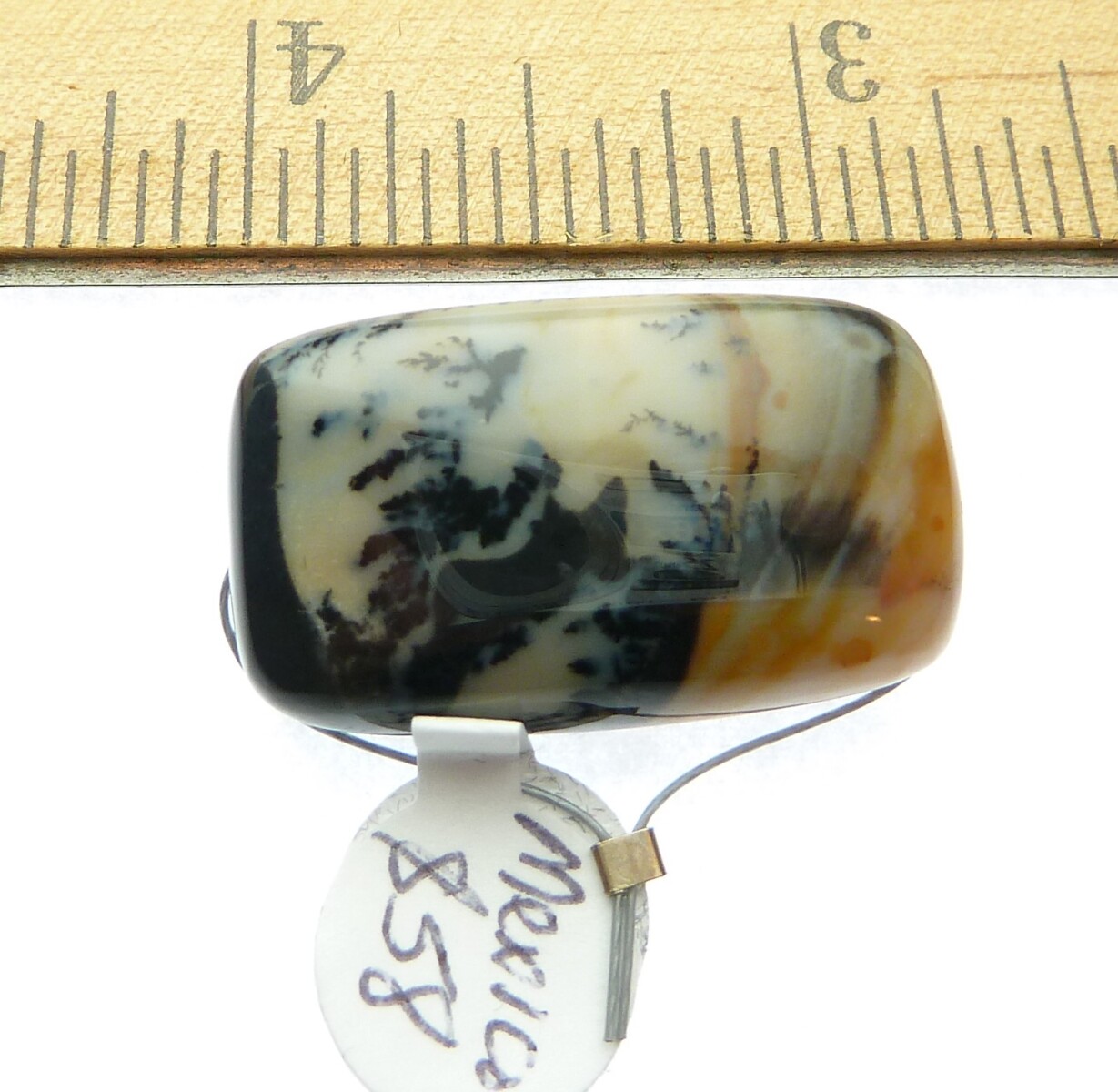 Scaled image P1010895.JPG: Item #SnowScene1, Price $58.00 Snow scene Agate pendant from Mexico. Hand cut snow scene agate pendant. Bead is 28 mm long by 16 mm wide. Drill hole size is about 3.0 mm. This stone is drilled vertically. This bead has a creamy white background color with black dendrites and a little amber color at one end of this bead.
P1010942.JPG ---- Item #MossAgate1, Price $45.00 Designer handcut Moss Agate pendant. Bead is 44 mm long by 21 mm wide. Drill hole size is about 2.0 mm. This stone is drilled horizontally.� 