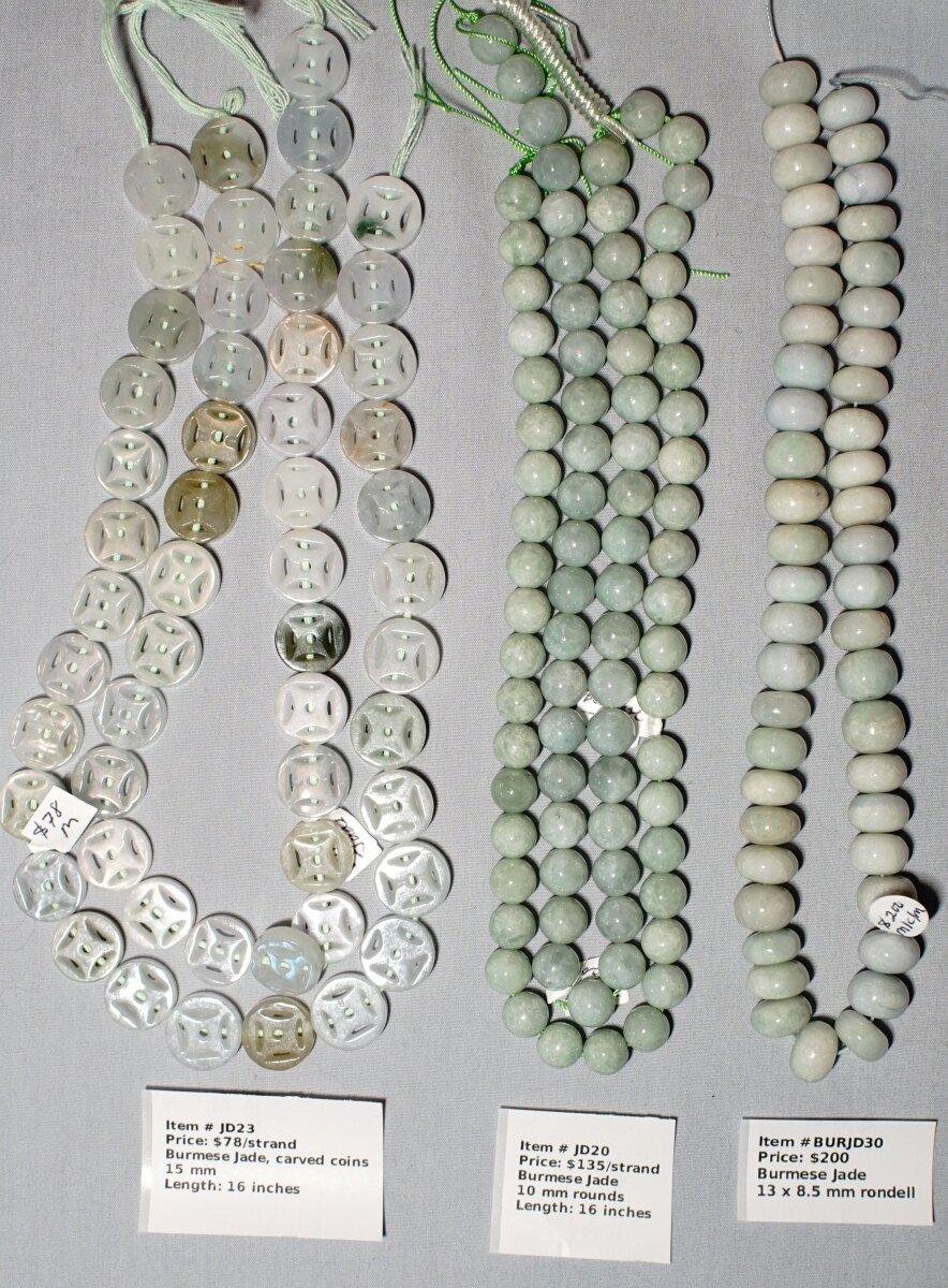 Scaled image BurmeseJade.JPG: Item # JD23-Carved coins, Burmese jade, 15 mm, $78/strand
Item # JD20-10 mm Burmese Jade rounds, $135/strand
Item # BURJD30-13x8.5 mm rondells, Burmese Jade� 