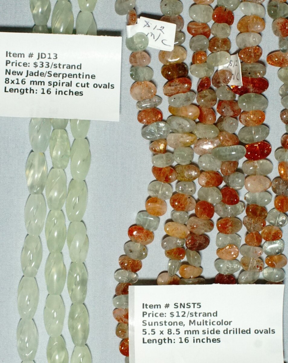 Scaled image NEWJd-SunstoneC.JPG: Item # JD13-New Jade (Serpentine), 8x16 mm spiral cut ovals, $33/strand
Item # SNST5-Sunstone, Multicolor, 5.5 x 8.5 mm side drilled ovals, $12/strand� 