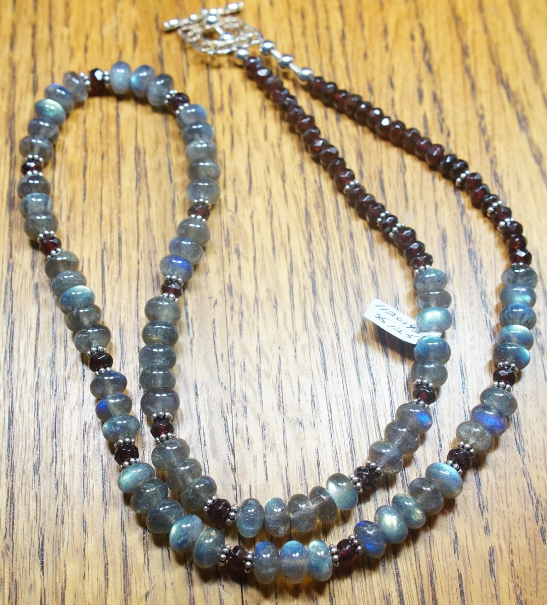 Scaled image Labradorite and Garnet.JPG: Item #1120142. $125. Labradorite Rondelles, Faceted Garnet, Bali spacers, Sterling Silver Beads and Clasp. 28 inches.� 