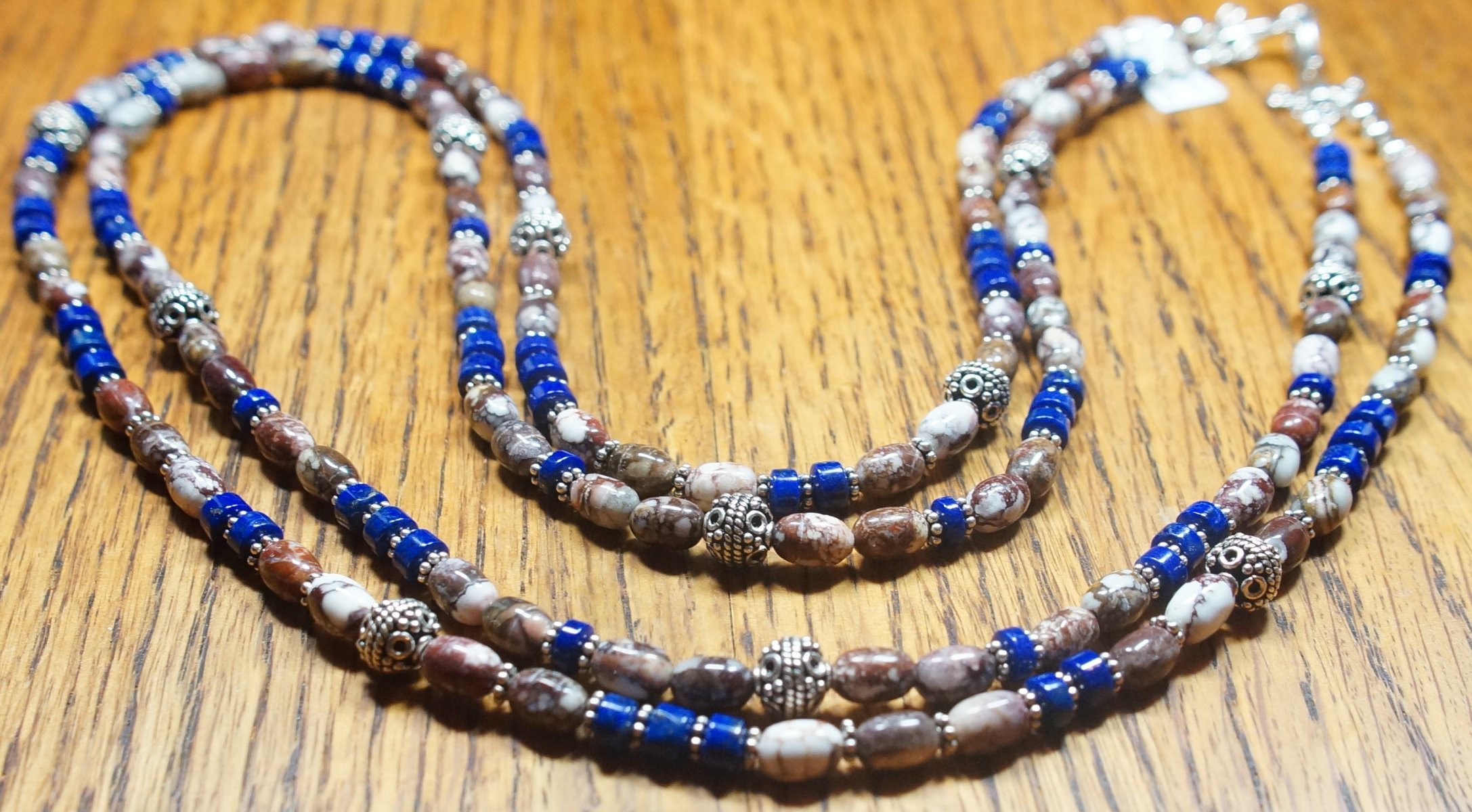Scaled image Lapis and Wild Horse.JPG: Item #20151214b. $295. Wild Horse Oval Barrels, Lapis Rondells, Sterling Silver Bali Beads, Findings and Clasp. Double Strand Necklace. 26/27 inches long.� 